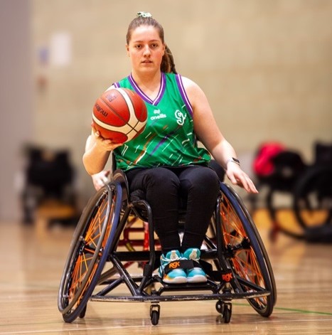 Teenage basketball player in a sports wheelchair