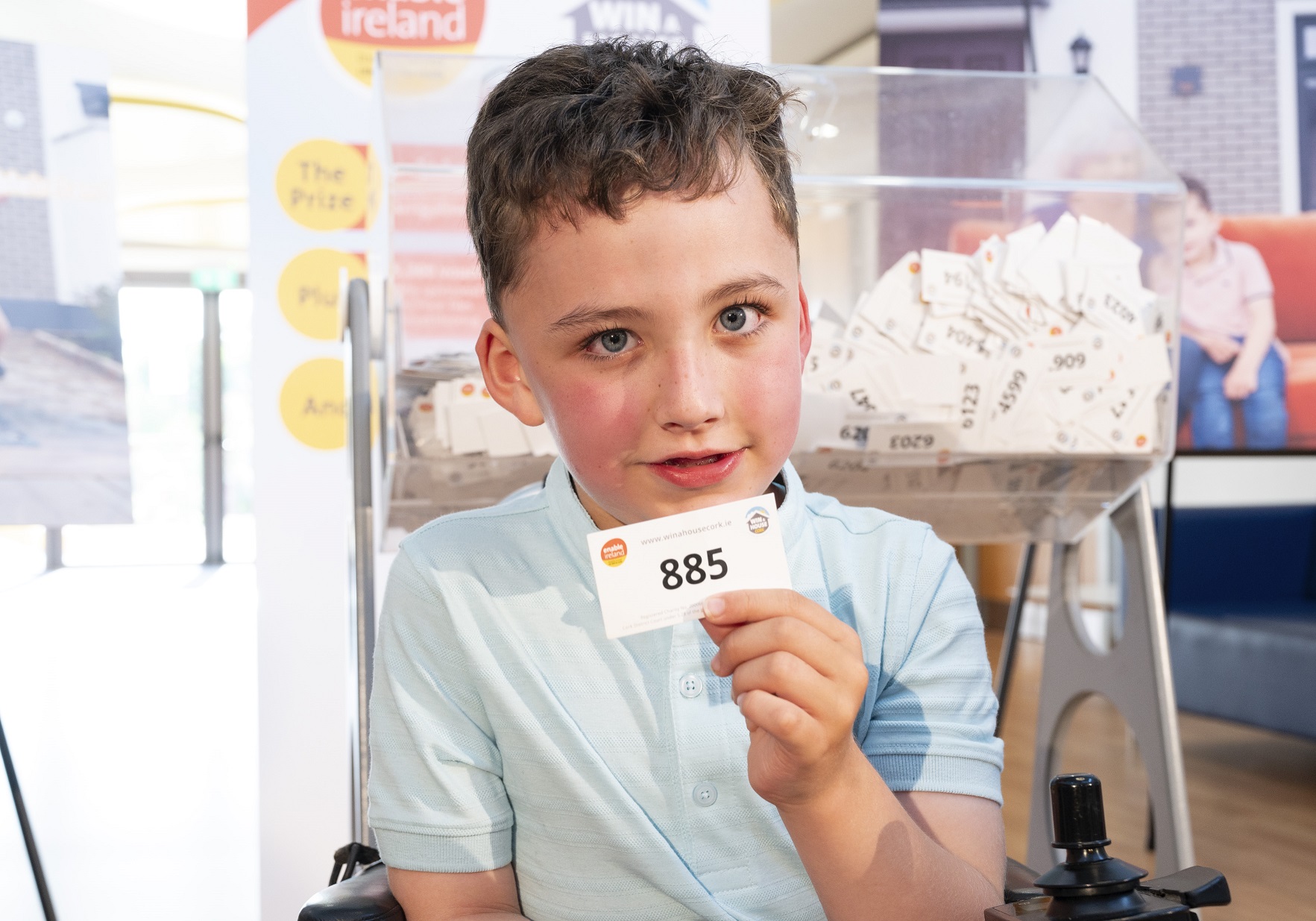 Boy holds up ticket no. 885