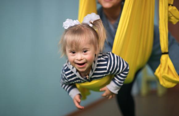 child enjoying a swing