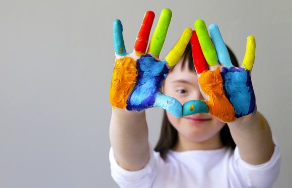 girl with painted hands 