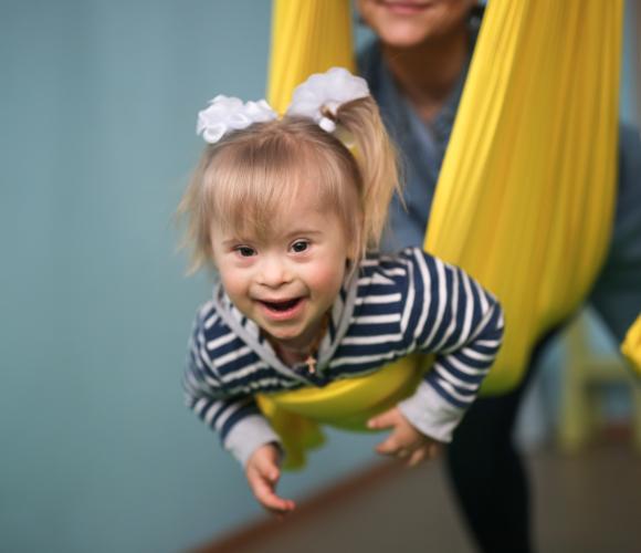 Girl in a yellow swing