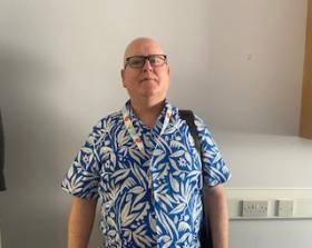 Man in a blue and white shirt