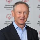 Profile of man wearing a blue jacket and shirt